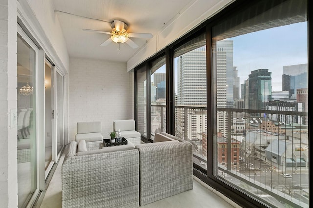 balcony with outdoor lounge area and ceiling fan