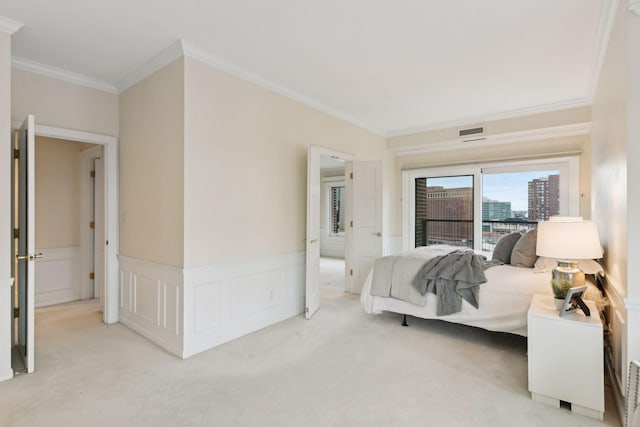 bedroom with light carpet and crown molding