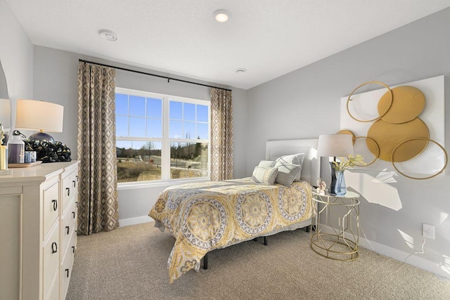 bedroom with light colored carpet