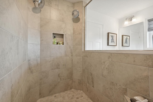 bathroom featuring tiled shower