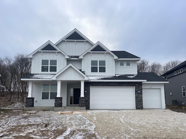 view of front of property with a garage and covered porch