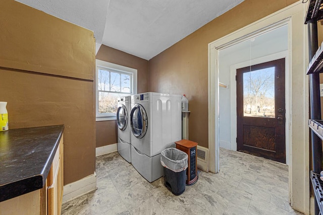 washroom with independent washer and dryer