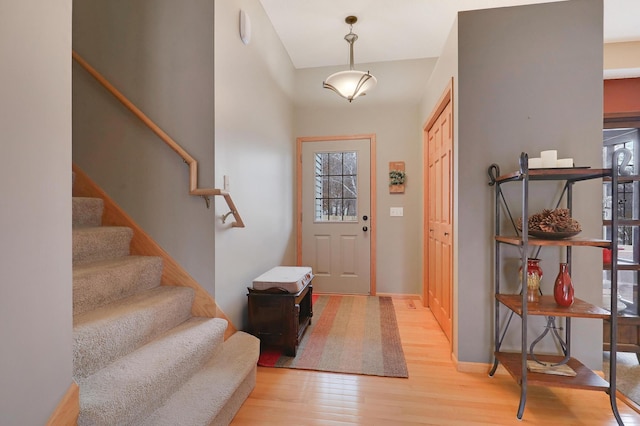 entryway featuring a wealth of natural light and light hardwood / wood-style floors