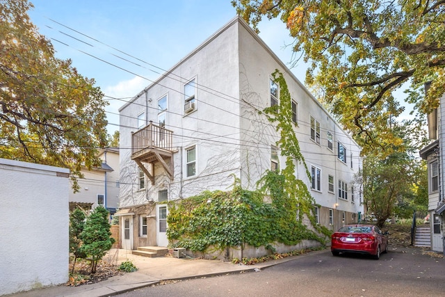 3421 Hennepin Ave Unit 5, Minneapolis, MN 55408 - view of front facade featuring cooling unit and stucco siding