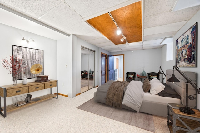 3421 Hennepin Ave Unit 5, Minneapolis, MN 55408 - carpeted bedroom with a paneled ceiling and a closet