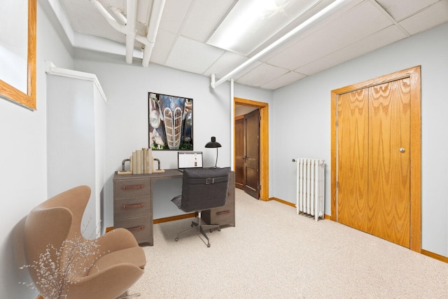 3421 Hennepin Ave Unit 5, Minneapolis, MN 55408 - home office with radiator heating unit, a paneled ceiling, and carpet flooring