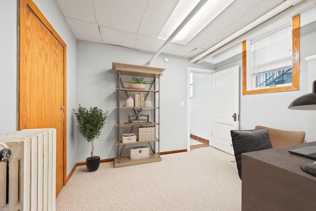 3421 Hennepin Ave Unit 5, Minneapolis, MN 55408 - carpeted home office featuring radiator heating unit and a paneled ceiling