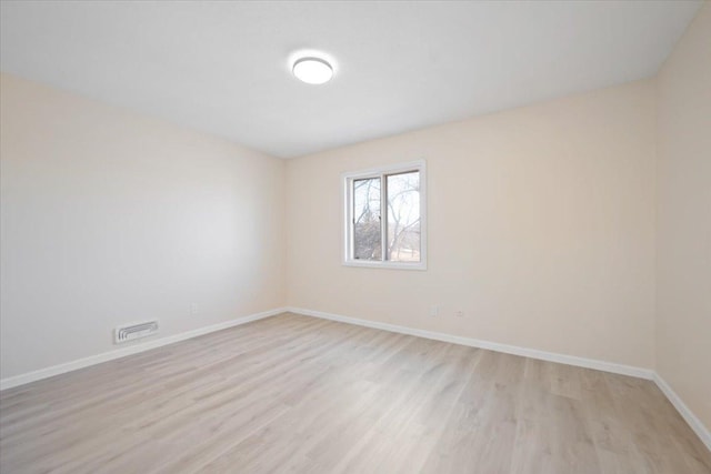 unfurnished room featuring light wood-type flooring