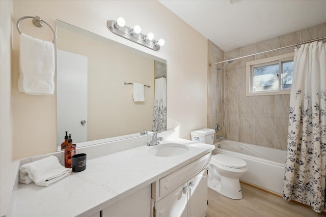 full bathroom with vanity, wood-type flooring, shower / bath combination with curtain, and toilet