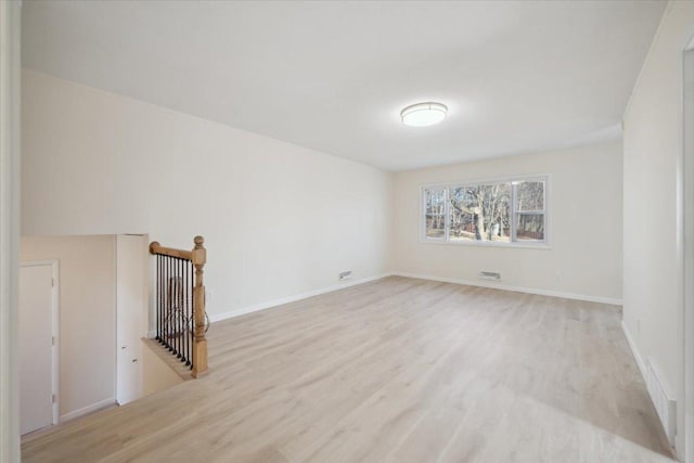 unfurnished living room featuring light wood-type flooring