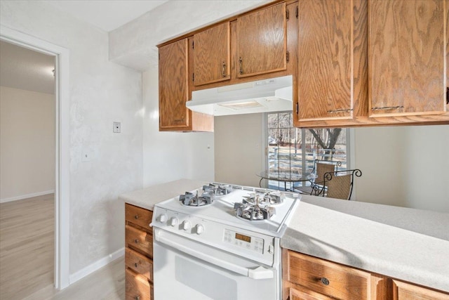 kitchen featuring white gas range