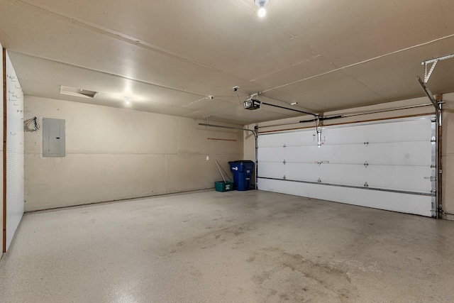 garage with a garage door opener and electric panel