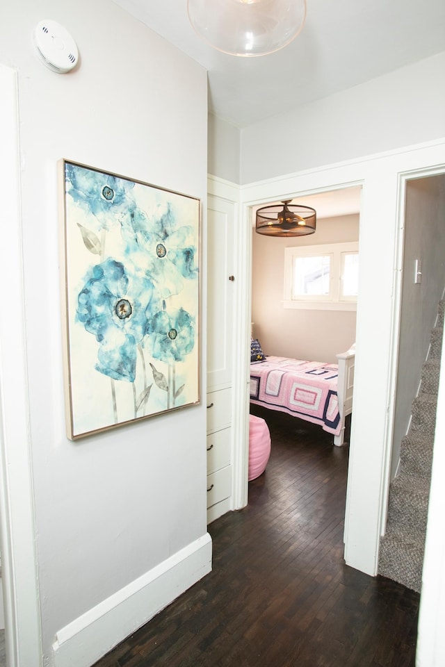 hallway with dark wood-type flooring