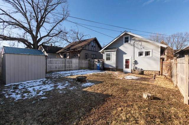 rear view of house with a shed