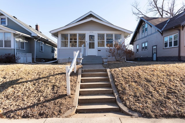 view of front of property featuring a sunroom