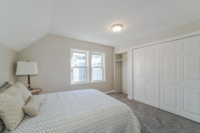 bedroom featuring vaulted ceiling and carpet floors