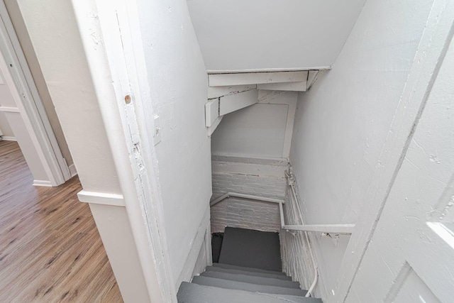 stairway featuring hardwood / wood-style flooring