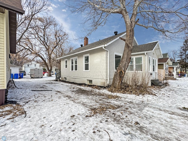 view of snow covered property