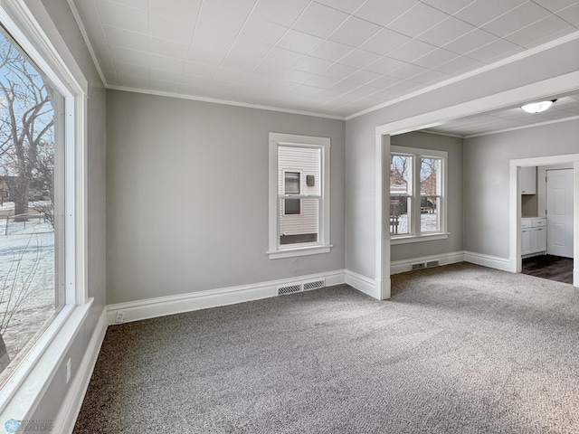 906 12th St N, Fargo, ND 58102 - empty room featuring crown molding and dark colored carpet