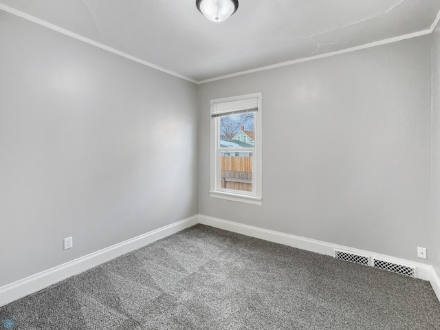 906 12th St N, Fargo, ND 58102 - spare room featuring ornamental molding and carpet