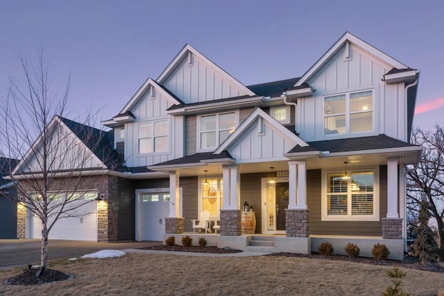 view of front of home with a garage and covered porch