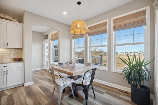 dining space with light hardwood / wood-style flooring