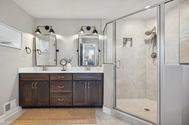 bathroom with vanity and an enclosed shower