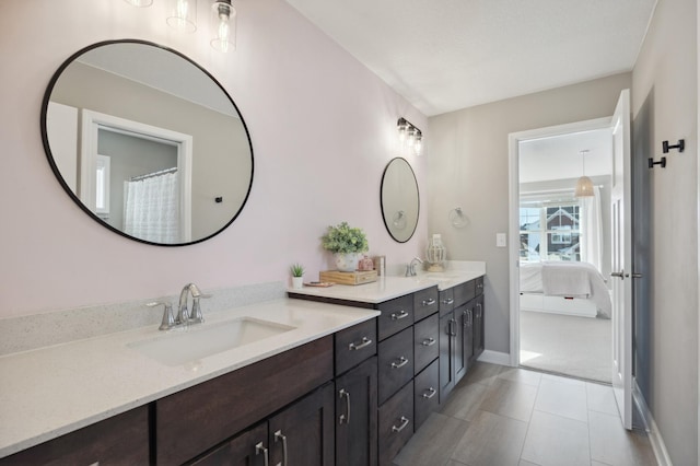 bathroom with tile patterned floors and vanity