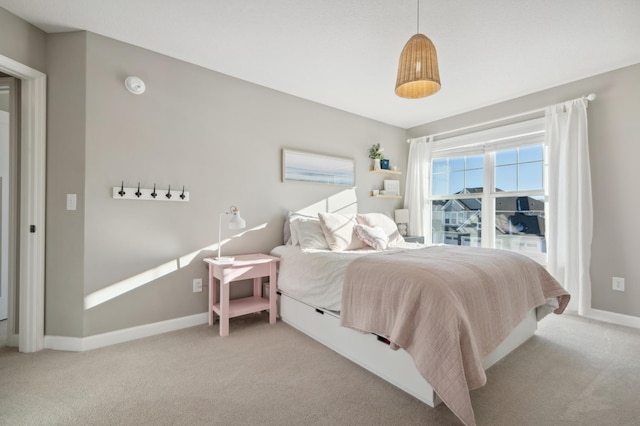 bedroom featuring light colored carpet