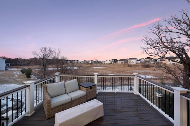 deck at dusk with outdoor lounge area