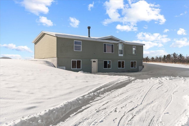 view of snow covered property