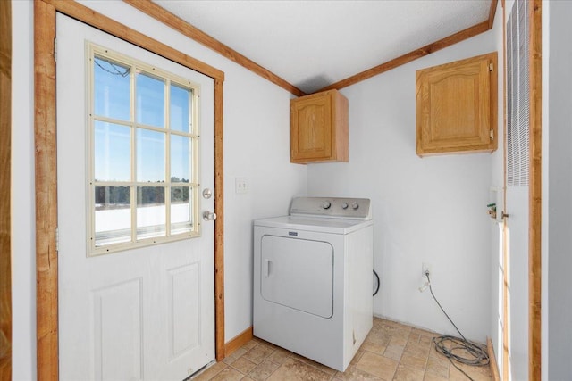 laundry room with washer / clothes dryer, crown molding, and cabinets