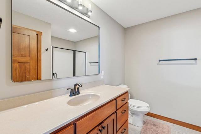 bathroom with walk in shower, tile patterned floors, vanity, and toilet