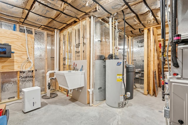 basement with water heater and sink