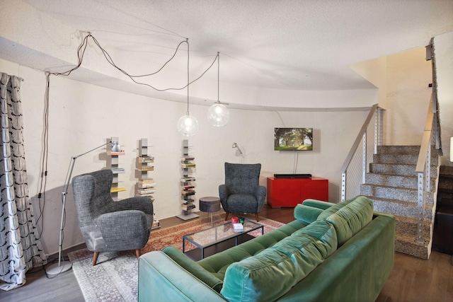 living room featuring hardwood / wood-style floors and a textured ceiling