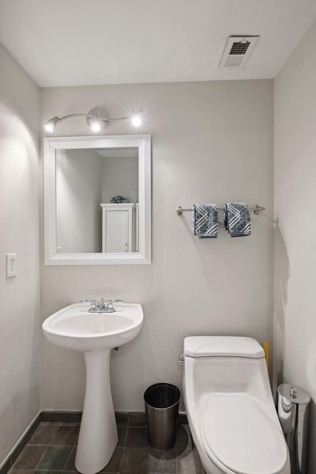 bathroom with tile patterned floors and toilet