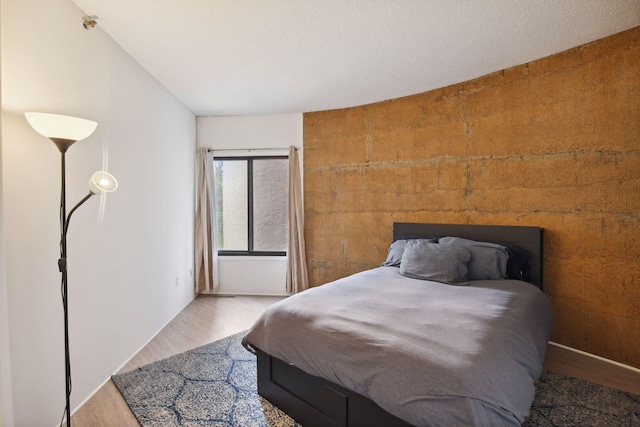 bedroom featuring wood-type flooring