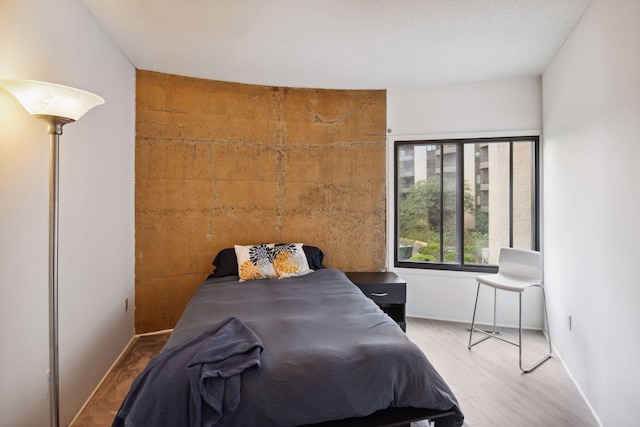 bedroom featuring hardwood / wood-style flooring