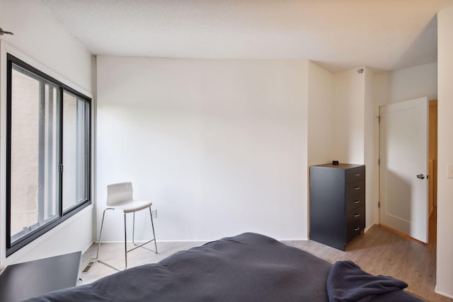 bedroom featuring light wood-type flooring