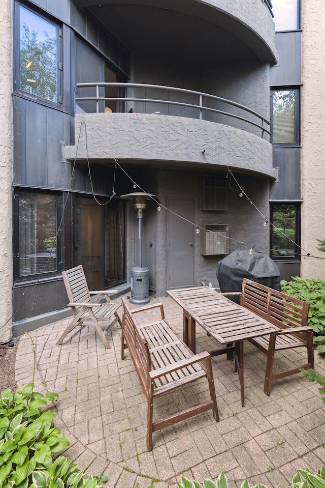 view of patio / terrace with a balcony and a grill