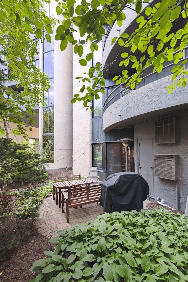 view of patio / terrace featuring area for grilling and a balcony