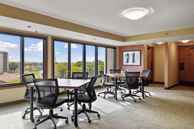 dining area with light colored carpet