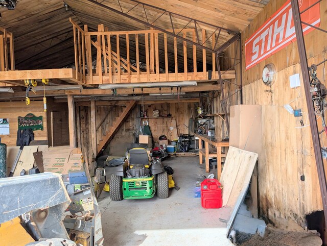 garage featuring wood walls