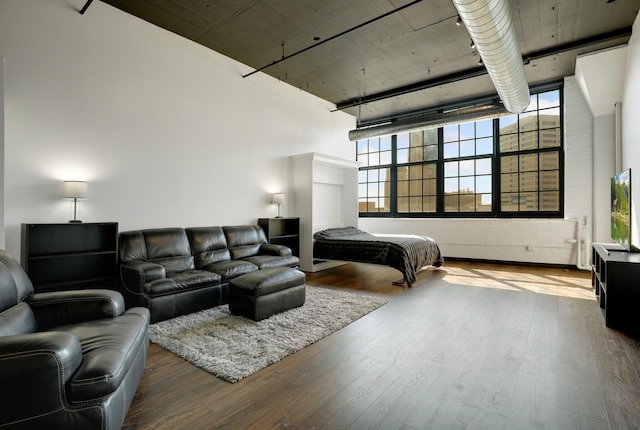 bedroom with hardwood / wood-style floors