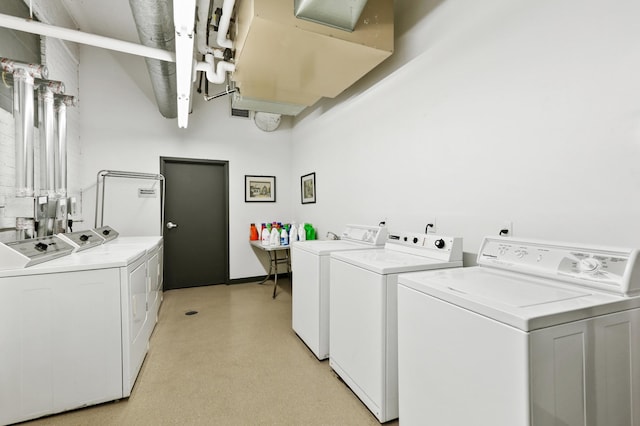 clothes washing area featuring washing machine and clothes dryer