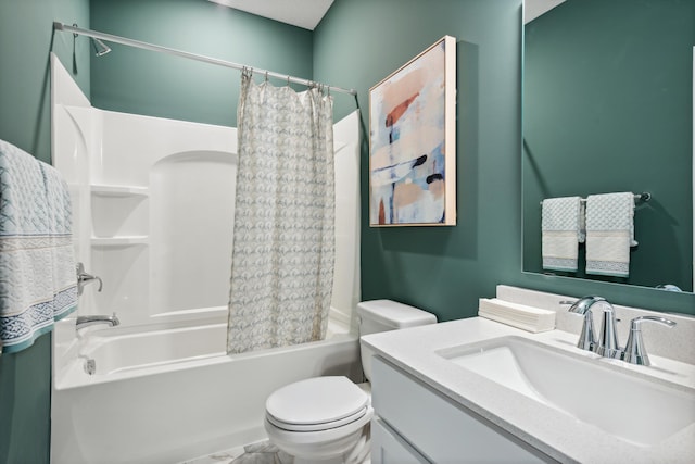 full bathroom with vanity, shower / bath combo with shower curtain, and toilet