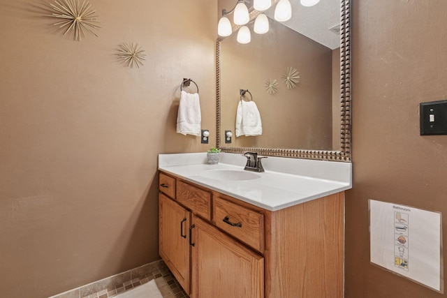 bathroom with baseboards and vanity