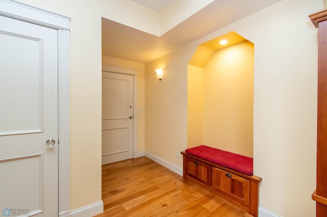 hall with light hardwood / wood-style floors