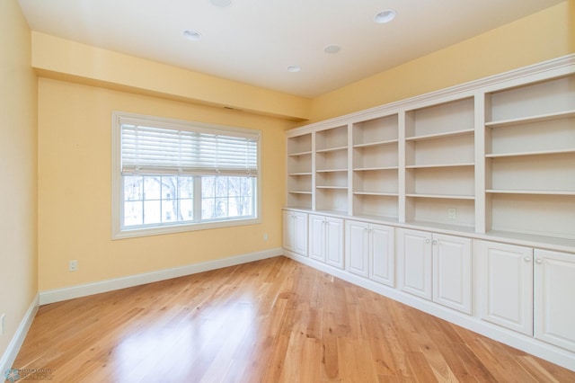 spare room with light hardwood / wood-style flooring