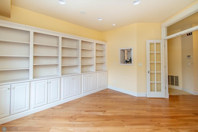 spare room featuring light wood-type flooring